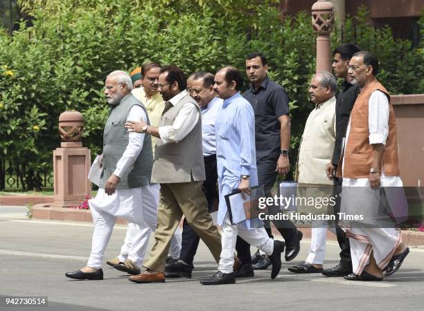 Prime Minister Narendra Modi with senior BJP leaders and Union Ministers after BJP Parliamentary Party Meeting at Parliament House library on April...