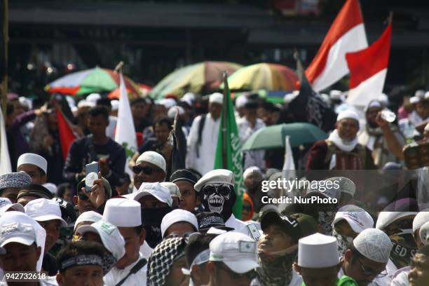 Thousands of Muslims rallied in front of the Indonesian Police Criminal Investigation Agency office, Jakarta, on Friday, April 6, 2018. The action...