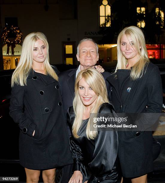 Models Karissa Shannon, playboy founder Hugh Hefner, model Crystal Harris and model Kristina Shannon attend the Hugh Hefner Autographs Limited...
