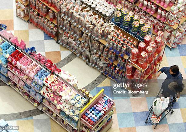 Woman shops at Seven & I Holdings Co.'s Ito-Yokado supermarket in Tokyo, Japan, on Friday, Dec. 11, 2009. Seven & I Holdings Co., owner of the...