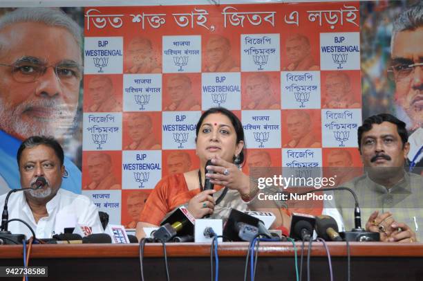 Union Information and Broadcasting Minister Smriti Irani addresses along BJP State Leader Mukul Roy and Rahul Sinha at Meet the Press Conferences at...