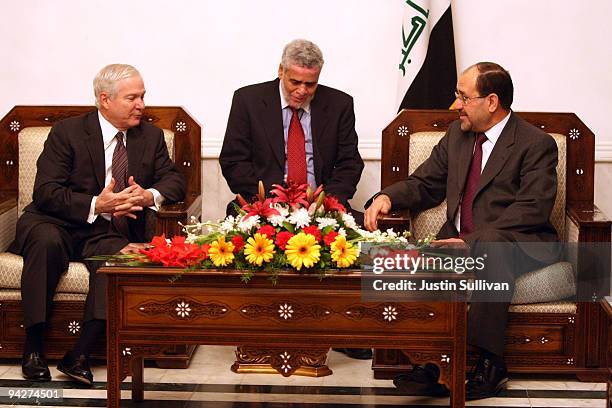 Secretary of Defense Robert Gates meets with Iraqi Prime Minister Nouri Al-Maliki at his residence in the Green Zone December 11, 2009 in Baghdad,...