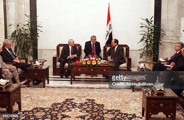 Secretary of Defense Robert Gates meets with Iraqi Prime Minister Nouri Al-Maliki at his residence in the Green Zone December 11, 2009 in Baghdad,...
