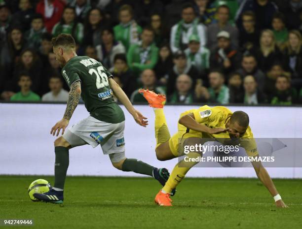 Saint-Etienne's French defender Mathieu Debuchy outruns Paris Saint-Germain's French forward Kylian Mbappe during the French L1 football match...