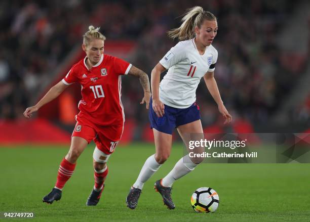 Toni Duggan of England breaks away from Jessica Fishlock of Wales during the Women's World Cup Qualifier match between England and Wales at St Mary's...