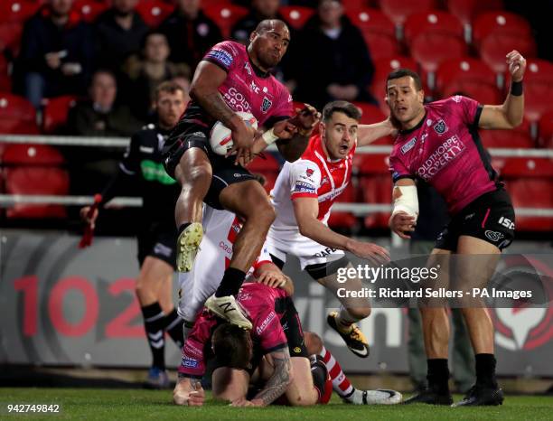 Hull FC's Fetuli Talanoa lands on his team mate Marc Sneyd during the Betfred Super League match at the Totally Wicked Stadium, St Helens.