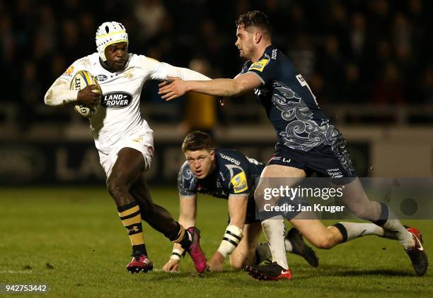 Christian Wade of Wasps is tackled by Luke James of Sale during the Aviva Premiership match between Sale Sharks and Wasps at AJ Bell Stadium on April...