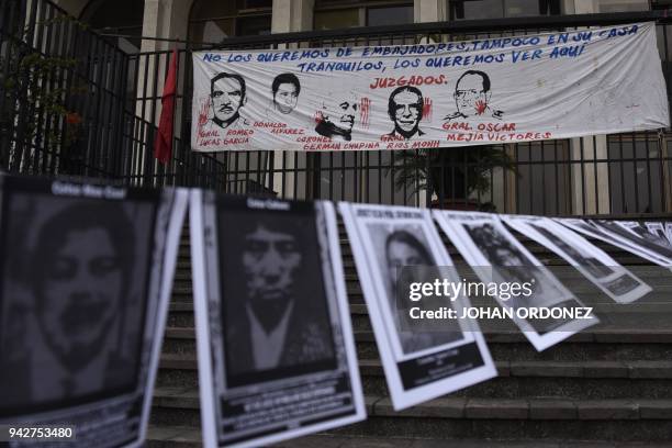 Portraits of missing persons within Guatemalan internal armed conflict, are displayed by human rights' organization "Hijos" during a protest at...