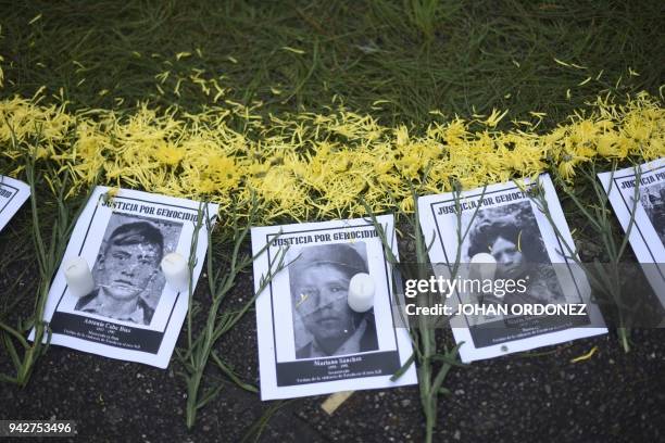 Portraits of missing persons within Guatemalan internal armed conflict, are displayed by human rights' organization "Hijos" during a protest at...