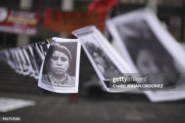 Portraits of missing persons within Guatemalan internal armed conflict, are displayed by human rights' organization "Hijos" during a protest at...