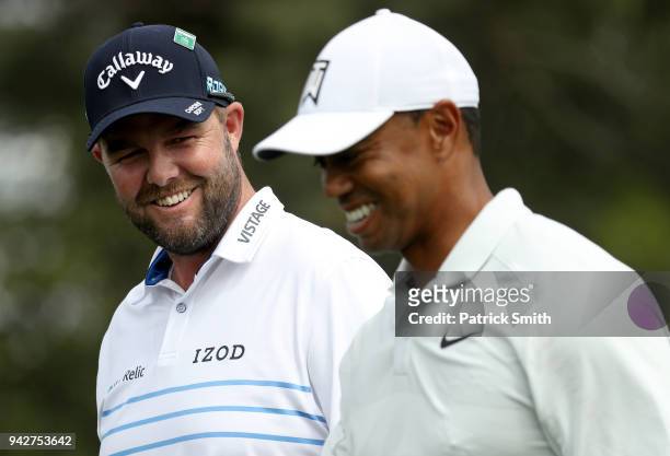 Marc Leishman of Australia and Tiger Woods of the United States walk off the eighth tee during the second round of the 2018 Masters Tournament at...