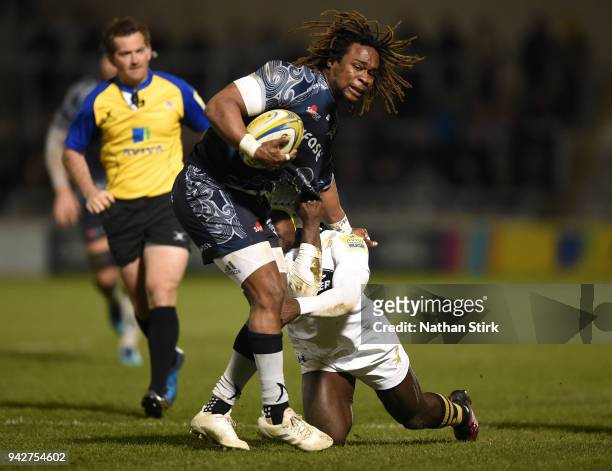 Marland Yarde of Sale is tackled by Christian Wade of Wasps during the Aviva Premiership match between Sale Sharks and Wasps at AJ Bell Stadium on...