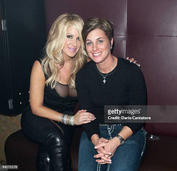 Personality Kim Zolciak and DJ Tracy Young pose at Splash Bar on December 10, 2009 in New York City.