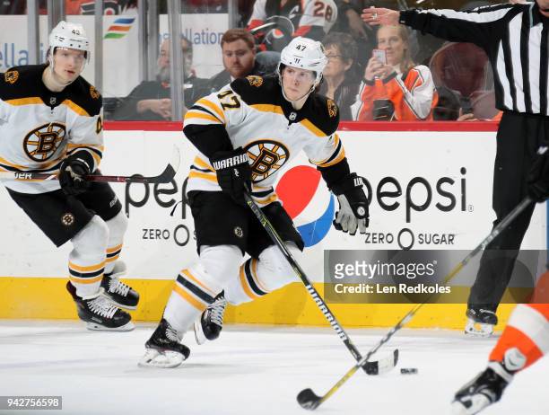 Torey Krug of the Boston Bruins skates the puck against the Philadelphia Flyers on April 1, 2018 at the Wells Fargo Center in Philadelphia,...