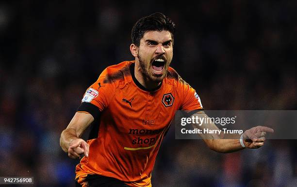 Ruben Neves of Wolverhampton Wanderers celebrates after scoring his sides first goal during the Sky Bet Championship match between Cardiff City and...