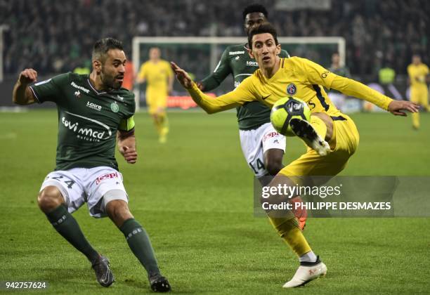 Paris Saint-Germain's Argentinian forward Angel Di Maria vies with Saint-Etienne's French defender Loic Perrin during the French L1 football match...