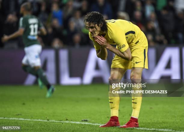 Paris Saint-Germain's Uruguayan forward Edinson Cavani reacts after missing a shot during the French L1 football match between AS Saint-Etienne and...