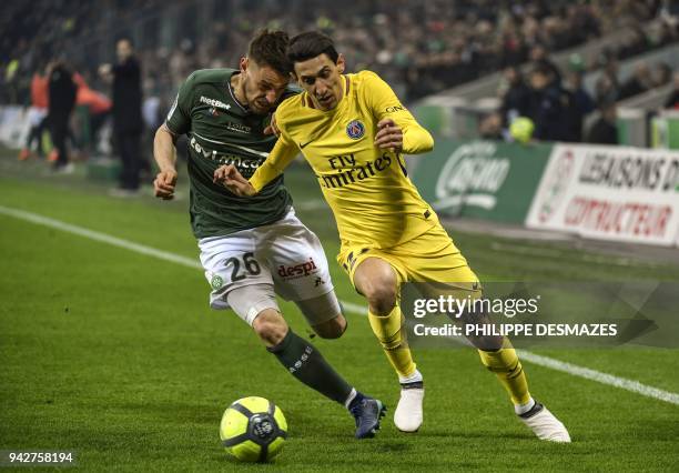 Paris Saint-Germain's Argentinian forward Angel Di Maria outruns Saint-Etienne's French defender Mathieu Debuchy during the French L1 football match...