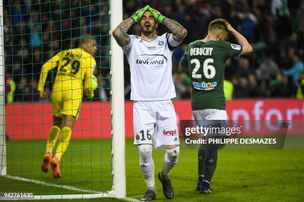 Saint-Etienne's French goalkeeper Stephane Ruffier reacts after Saint-Etienne's French defender Mathieu Debuchy scored a last minute own goal,...