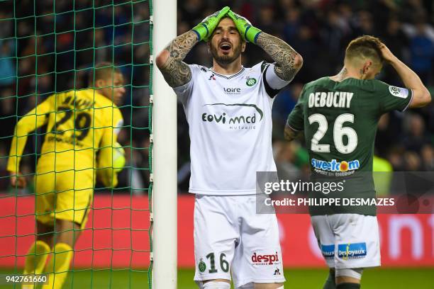 Saint-Etienne's French goalkeeper Stephane Ruffier reacts after Saint-Etienne's French defender Mathieu Debuchy scored a last minute own goal, as...