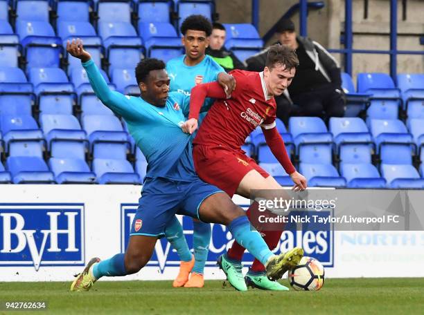 Liam Millar of Liverpool and Tolaji Bola of Arsenal in action during the Liverpool U23 v Arsenal U23 game at Prenton Park on April 6, 2018 in...