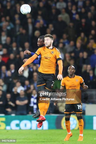 Junior Hoilett of Cardiff City and Matt Doherty of Wolverhampton Wanderers contend for the aerial ball during the Sky Bet Championship match between...