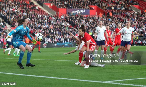 Jodie Taylor of England is kept from making a shot by Angharad James of Wales during the Womens World Cup Qualifier between England and Wales Women...