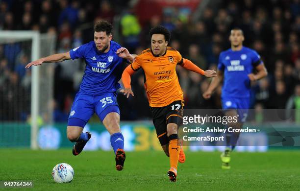 Cardiff City's Yanic Wildschut battles with Wolverhampton Wanderers' Helder Costa during the Sky Bet Championship match between Cardiff City and...