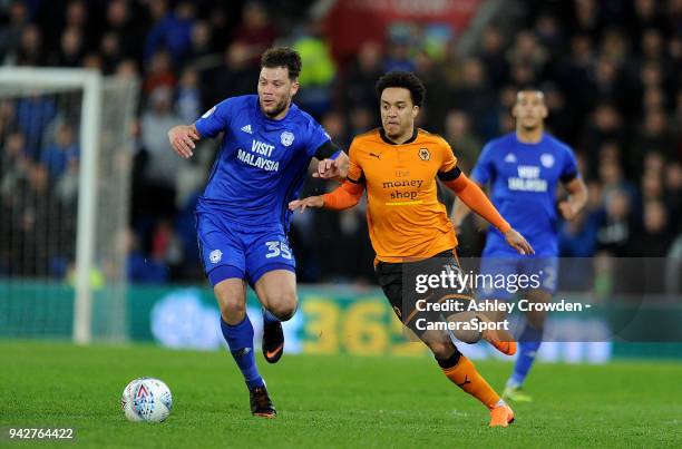 Cardiff City's Yanic Wildschut battles with Wolverhampton Wanderers' Helder Costa during the Sky Bet Championship match between Cardiff City and...