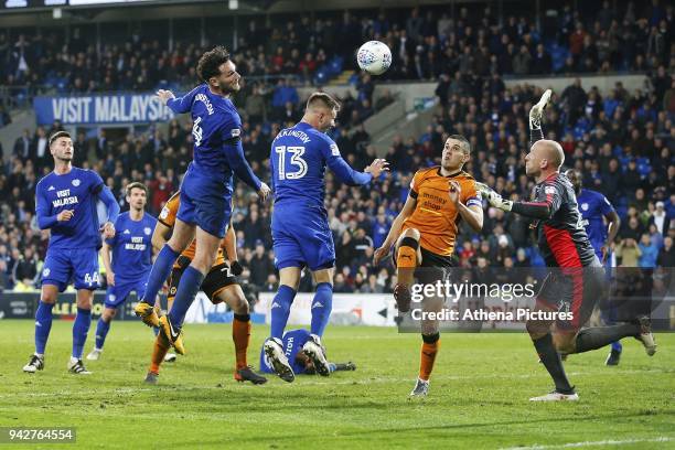 John Ruddy of Wolverhampton Wanderers pushes away a header from Sean Morrison of Cardiff City during the Sky Bet Championship match between Cardiff...