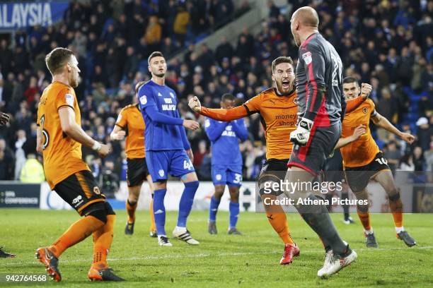 Wolves celebrate with John Ruddy of Wolverhampton Wanderers after saving the first penalty of the game during the Sky Bet Championship match between...