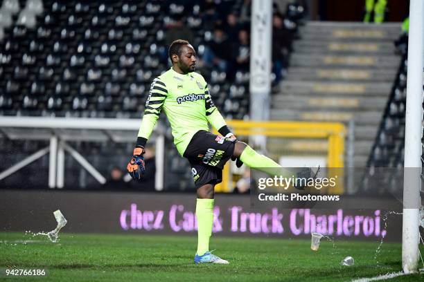 Parfait Junior Mandanda goalkeeper of Sporting Charleroi shoots at some beer cups throwing at him by RSCA supporters during the Jupiler Pro League...