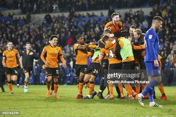 Wolverhampton Wanderers manager Nuno Espirito Santo joins as Wolves celebrate with keeper John Ruddy of Wolverhampton Wanderers after the final...