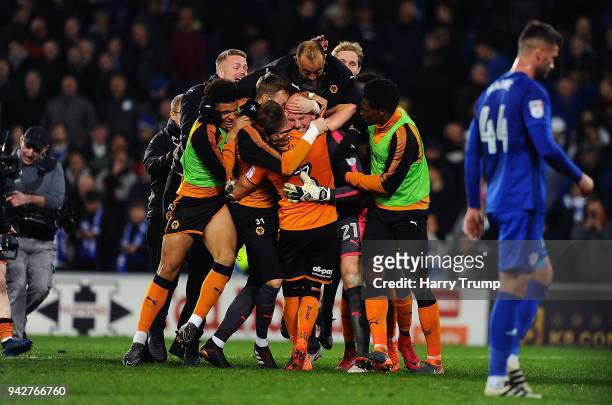 The players and Nuno Espirito Santo, Manager of Wolverhampton Wanderers celebrate with keeper John Ruddy of Wolverhampton Wanderers after he saves...