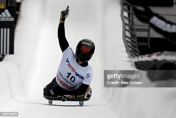 Kerstin Szymkowiak of Germany celebrates after winning the skeleton competition during the FIBT Bob & Skeleton World Cup at the bob run on December...