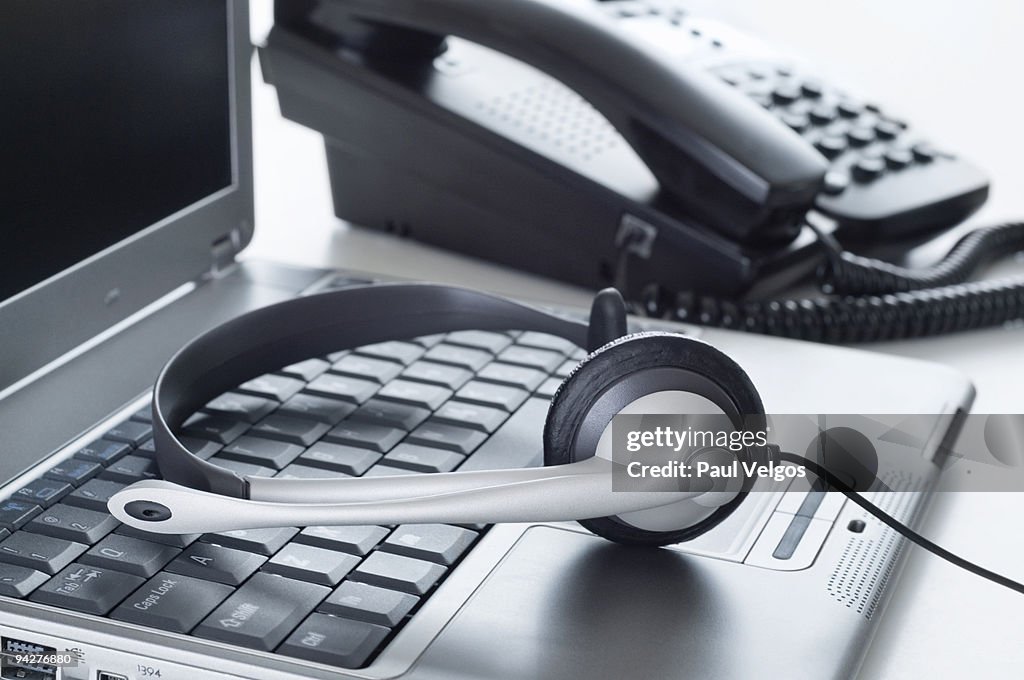 Computer Phone Work Headphones Laptop Computer And Business Phone High-Res Stock Photo ...