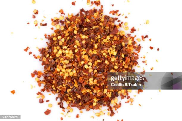 pile of a crushed red pepper - chilli powder stock-fotos und bilder