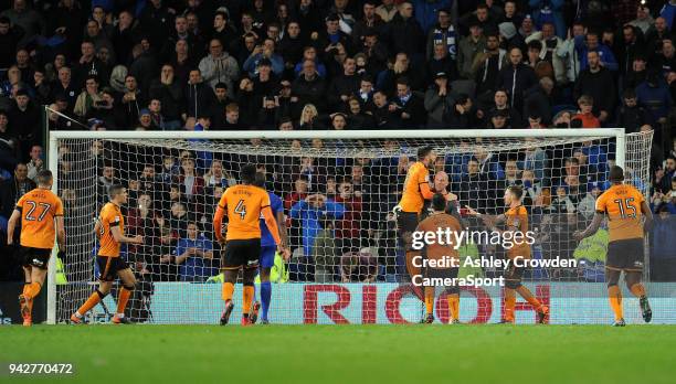 Wolverhampton Wanderers' John Ruddy is mobbed after saving Cardiff City's Gary Madine penalty during the Sky Bet Championship match between Cardiff...