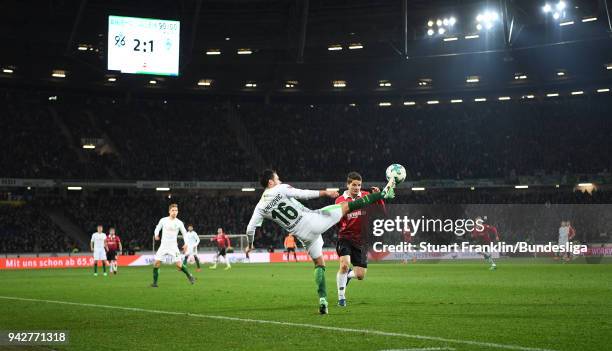 Zlatko Junuzovic of Bremen is challenged by Oliver Sorg of Hannover during the Bundesliga match between Hannover 96 and SV Werder Bremen at HDI-Arena...