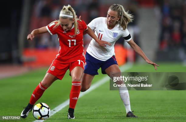 Charlotte Estcourt of Wales battles for posession with Toni Duggan of England during the Women's World Cup Qualifier between England and Wales at St...