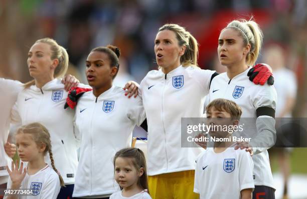 England sing the national anthem prior to the Women's World Cup Qualifier between England and Wales at St Mary's Stadium on April 6, 2018 in...