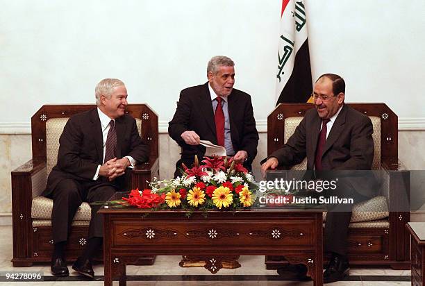 Secretary of Defense Robert Gates meets with Iraqi Prime Minister Nouri Al-Maliki at his residence in the Green Zone December 11, 2009 in Baghdad,...