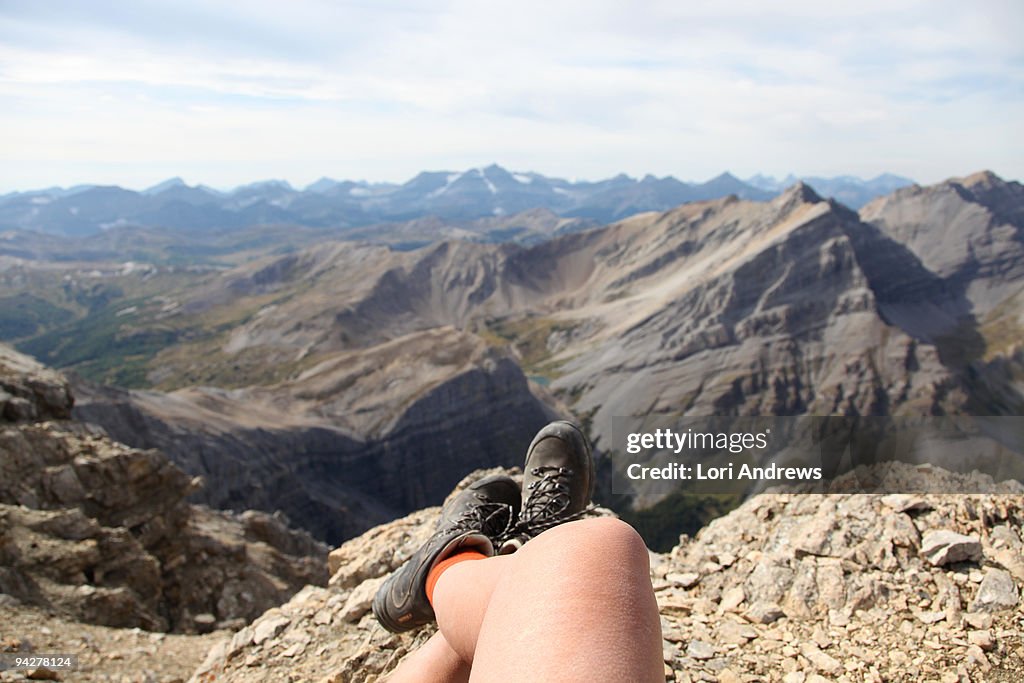 Crossed legs on top of the mountain
