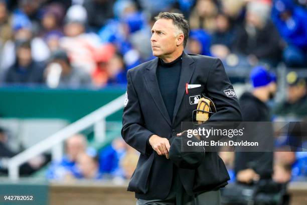 Umpire Dan Iassogna waits for the bottom of the first inning to start between the Chicago White Sox and the Kansas City Royals at Kauffman Stadium on...