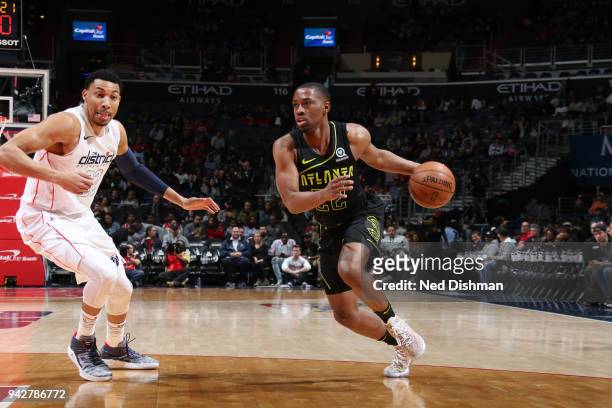 Isaiah Taylor of the Atlanta Hawks handles the ball against Otto Porter Jr. #22 of the Washington Wizards on April 6, 2018 at Capital One Arena in...