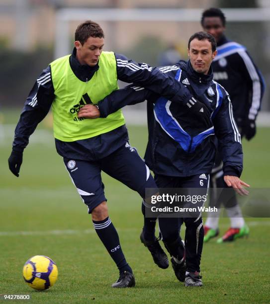 Ricardo Carvalho and Nemanja Matic of Chelsea in action during a training session at the Cobham training ground on December 11, 2009 in Cobham,...