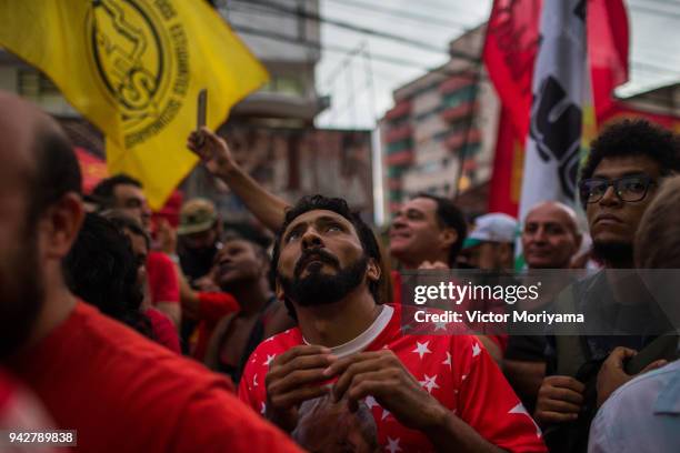 Supporters of former President Luiz Inacio Lula da Silva gather in front of the headquarters of the Metalworkers' Union while awaiting Lula's speech...