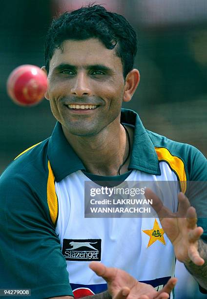 Pakistani cricketer Abdul Razzaq catches a ball during a practice session at The P. Saravanamuttu Stadium in Colombo on July 10 ahead of the second...