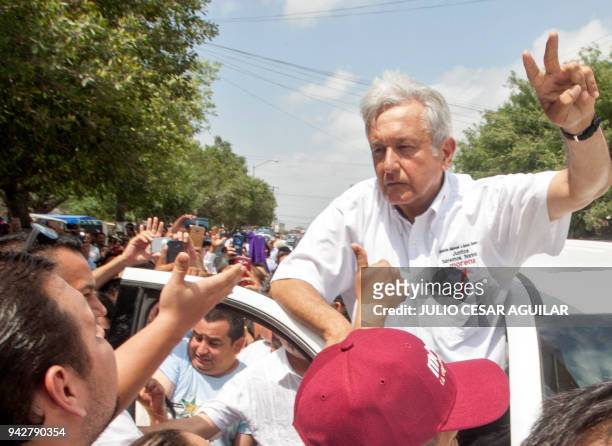 Mexico's presidential candidate for the MORENA party, Andres Manuel Lopez Obrador, flashes the V sign during a campaign rally in Rio Bravo,...
