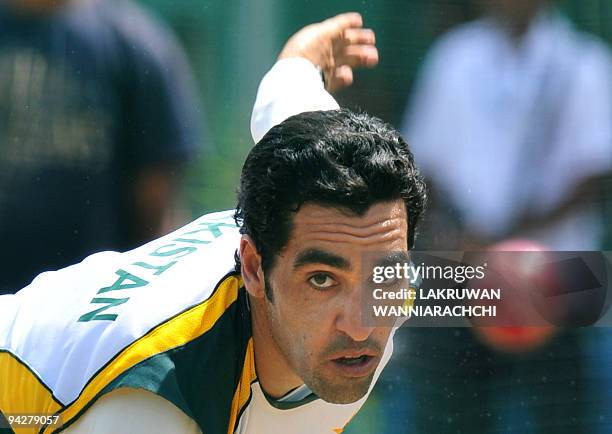 Pakistani cricketer Umar Gul delivers a ball during a practice session at The P. Saravanamuttu Stadium in Colombo on July 10 ahead of the second Test...